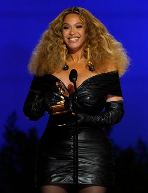 Beyonce accepts the award for best R&B performance for "Black Parade" at the 63rd annual Grammy Awards.