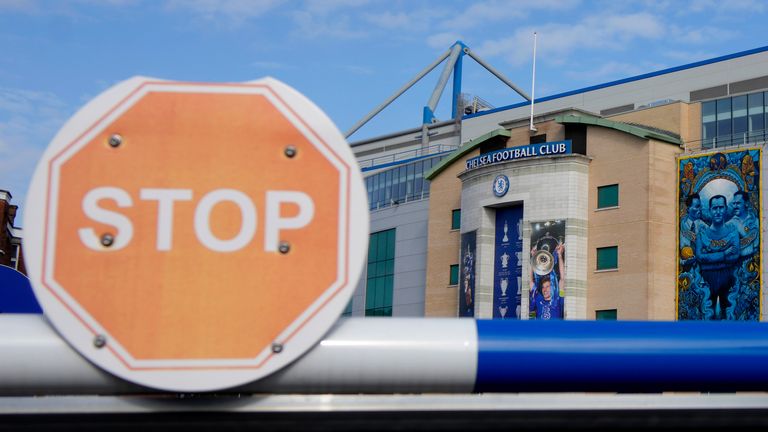 A barrier at an entrance to Chelsea football club&#39;s Stamford Bridge stadium in London, Thursday, March 10, 2022. Unprecedented restrictions have been placed on Chelsea’s ability to operate by the British government after owner Roman Abramovich is targeted in sanctions. Abramovich is among seven wealthy Russians who had their assets frozen by the government. (AP Photo/Kirsty Wigglesworth)